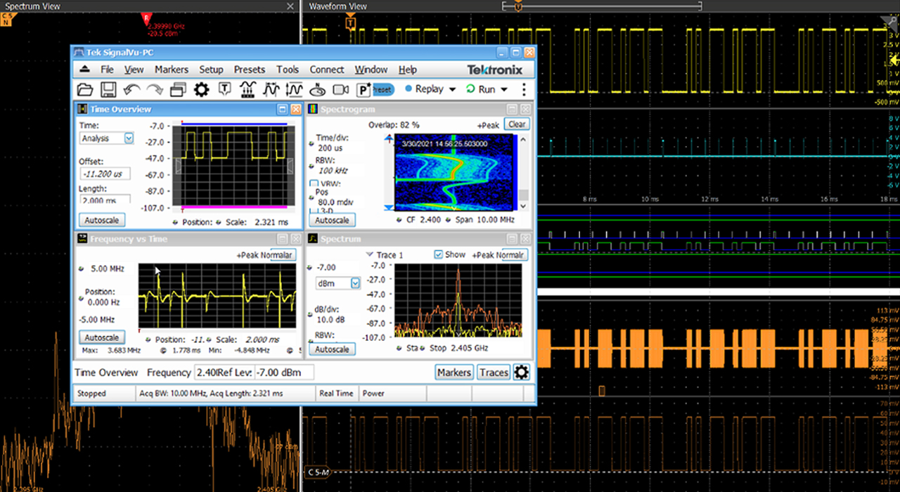 A screenshot of a Tektronix oscilloscope display showing multiple waveform traces and signal measurements in both time and frequency domains
