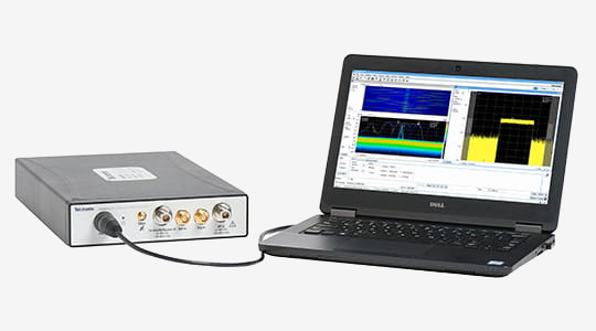 RSA607A Spectrum Analyzer plugged into a tablet PC running SignalVu-PC and displaying a DPX density trigger