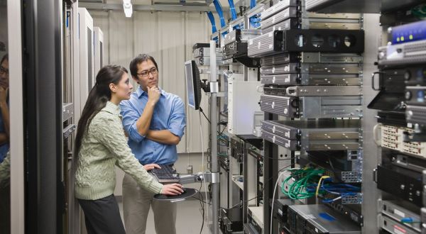 calibration technician and customer service engineer evaluating tailored calibration service solution