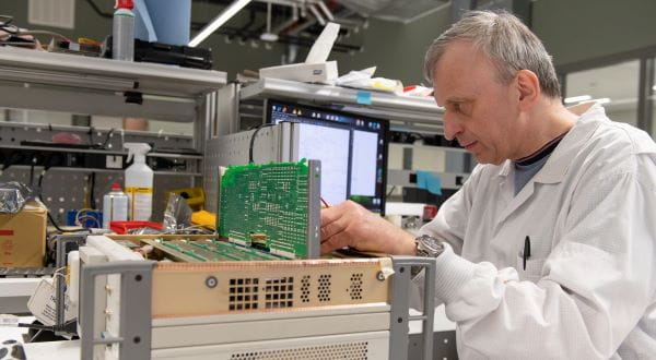 Calibration technician performing a high quality calibration service on electronic test and measurement equipment