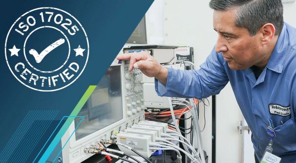 Engineer operating an ISO9000 certified oscilloscope