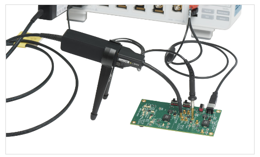 Image of a Tektronix IsoVu optically isolated probe connected to an oscilloscope and a device Under test