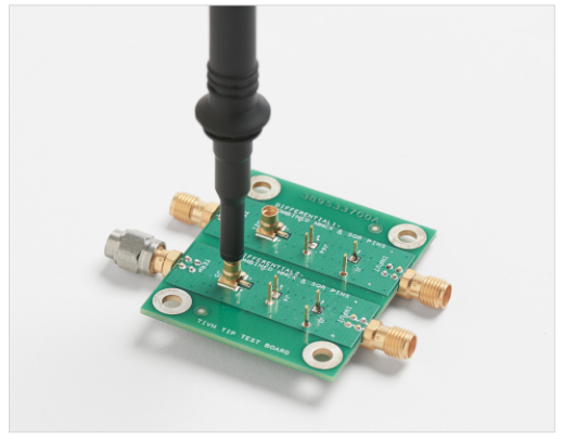 An image of a  TPP1000 1 GHz 10X probe with an MMCX cartridge installed, connected directly to an MMCX connector on a circuit board 