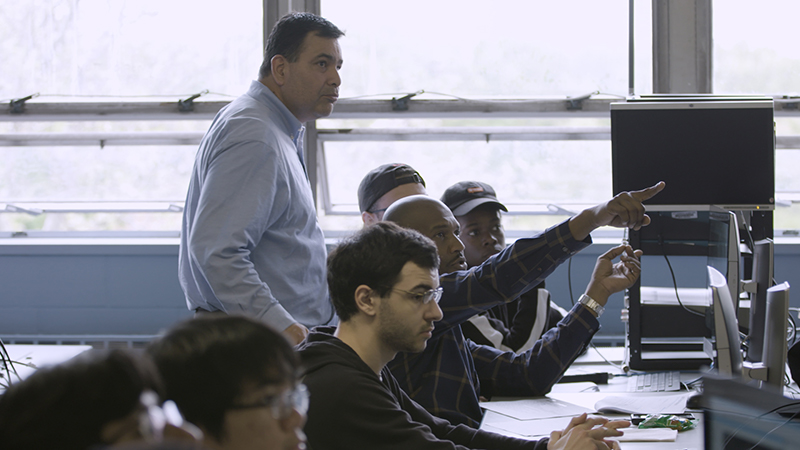 Enrique with his students